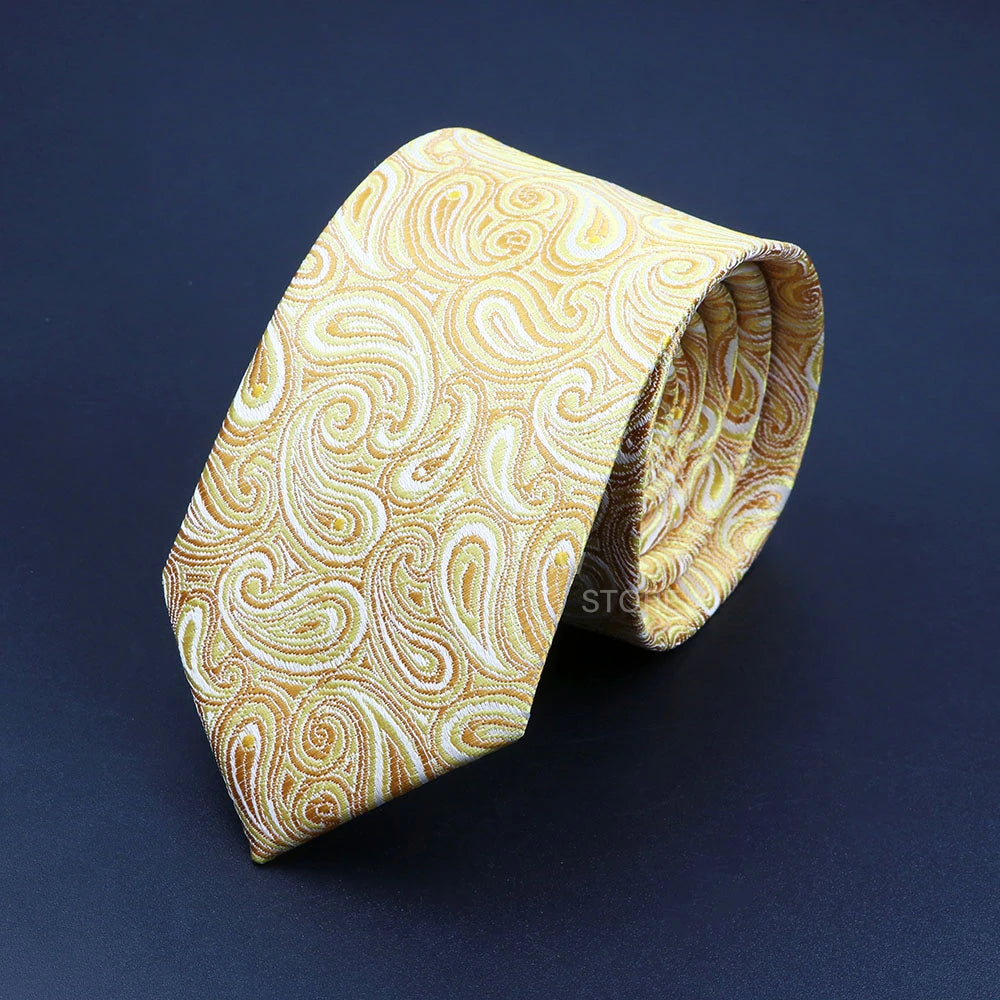 Gold patterned tie on a dark blue background