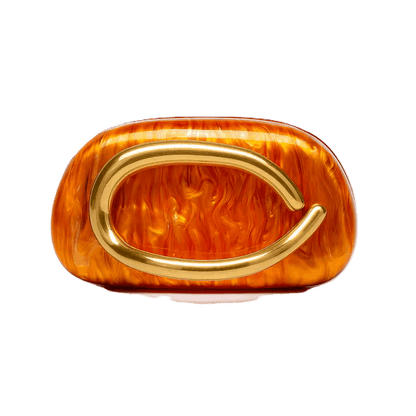 Decorative object with gold arch and orange-brown textured surface on a white background