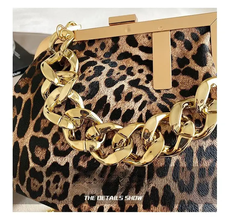 Leopard print clutch with gold chain detail