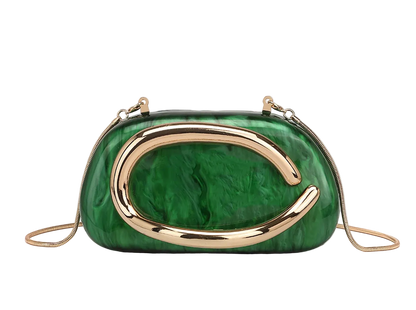 Green marbled handbag with gold accents on a beige background