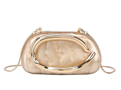 Gold and beige handbag with a unique design on a light background