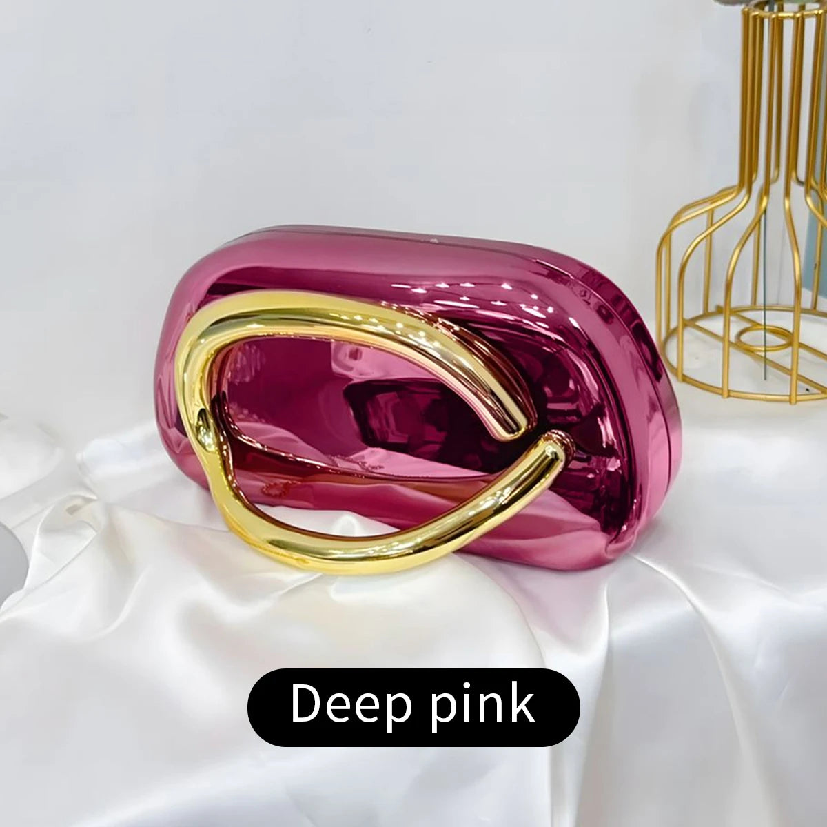 Deep pink Carauana Festival Clutch Bag  with gold handle 