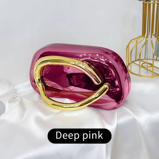 Deep pink Carauana Festival Clutch Bag  with gold handle 
