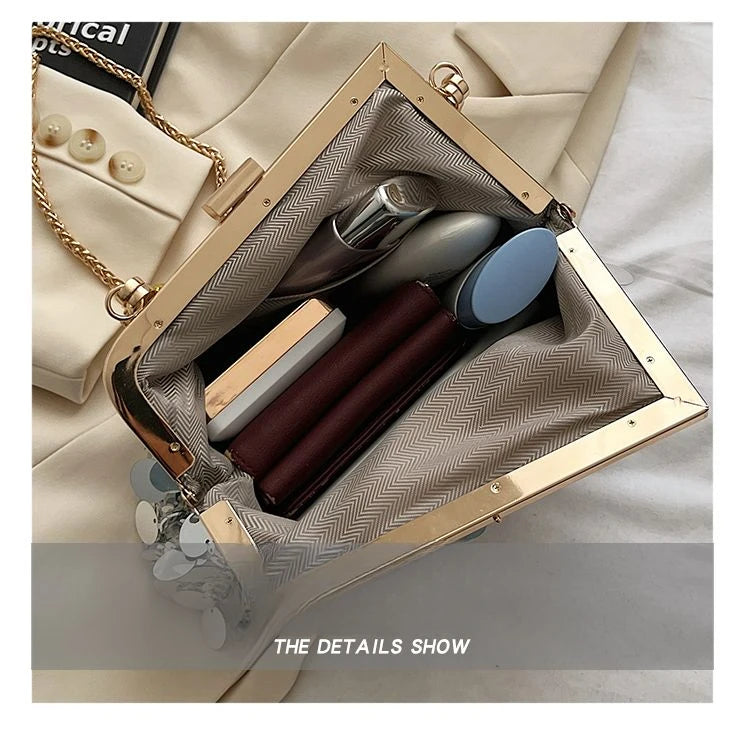 Open handbag with makeup items on a light background