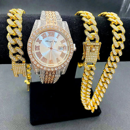 Gold watch and bracelet set on a black stand