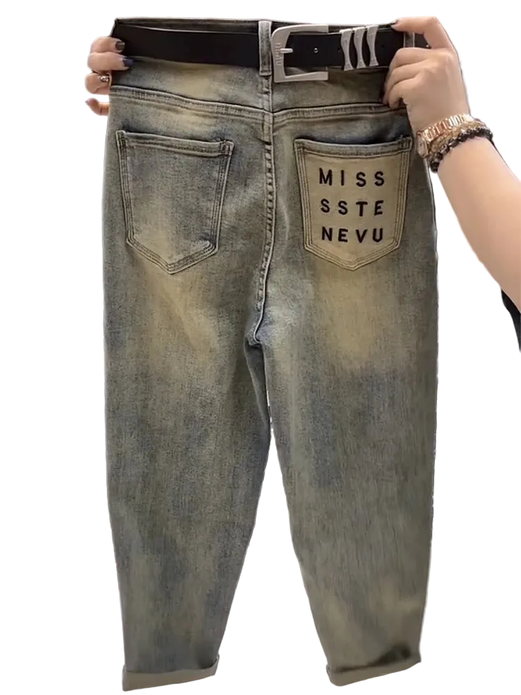 Denim jeans with 'MISS SSTE NEVU' branding