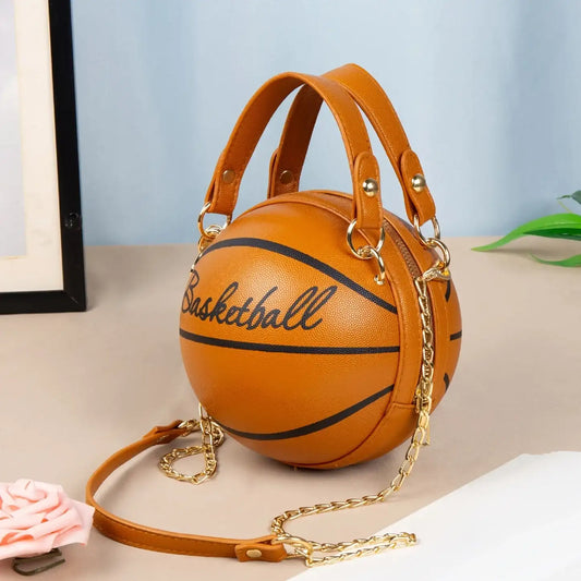 Basketball-shaped handbag with 'Basketball' text on a light surface.