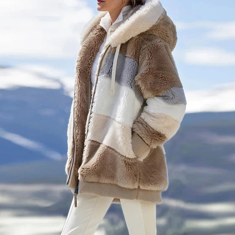 Person wearing a brown and beige sherpa jacket