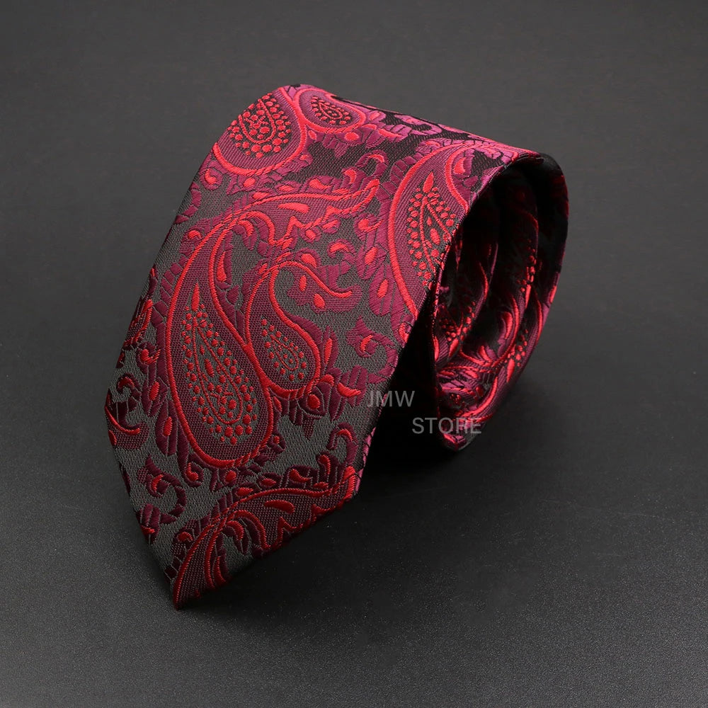 Red paisley patterned tie on a dark gray background