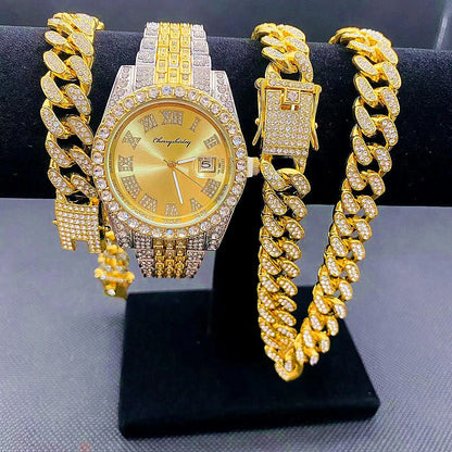 Gold watch and bracelet set on a black stand with a gray background